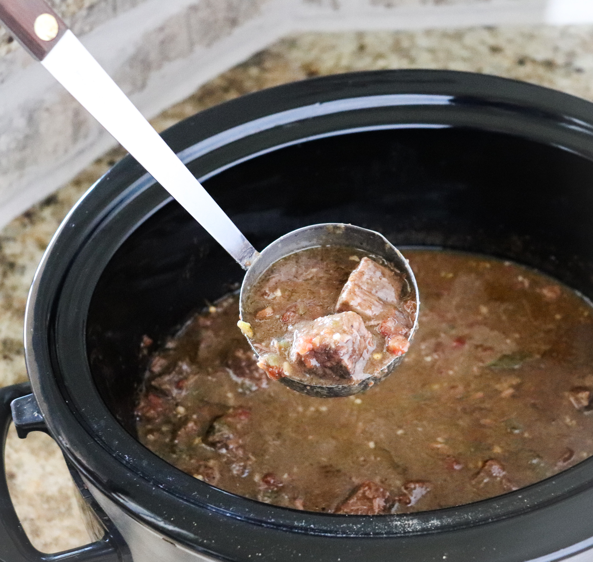 crock-pot of cooked Carne Guisada
