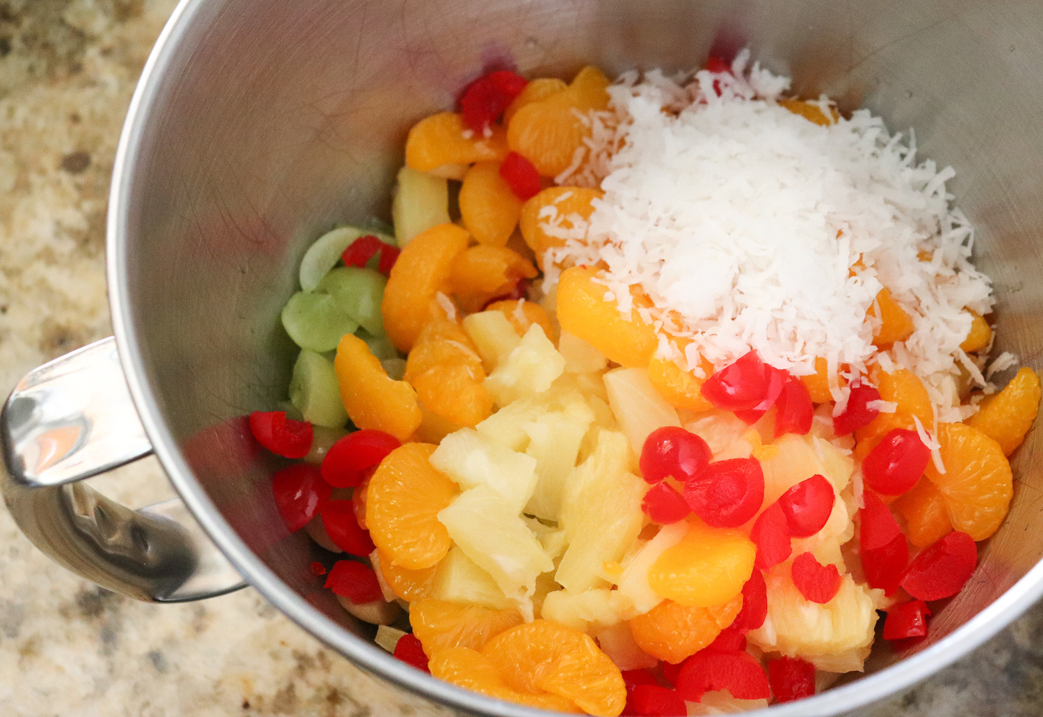 mixing bowl of diced fruit