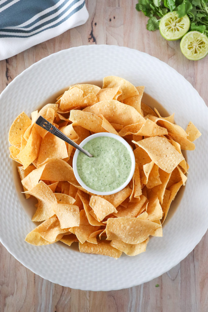 jalapeno avocado ranch dip in serving bowl with tortilla chips