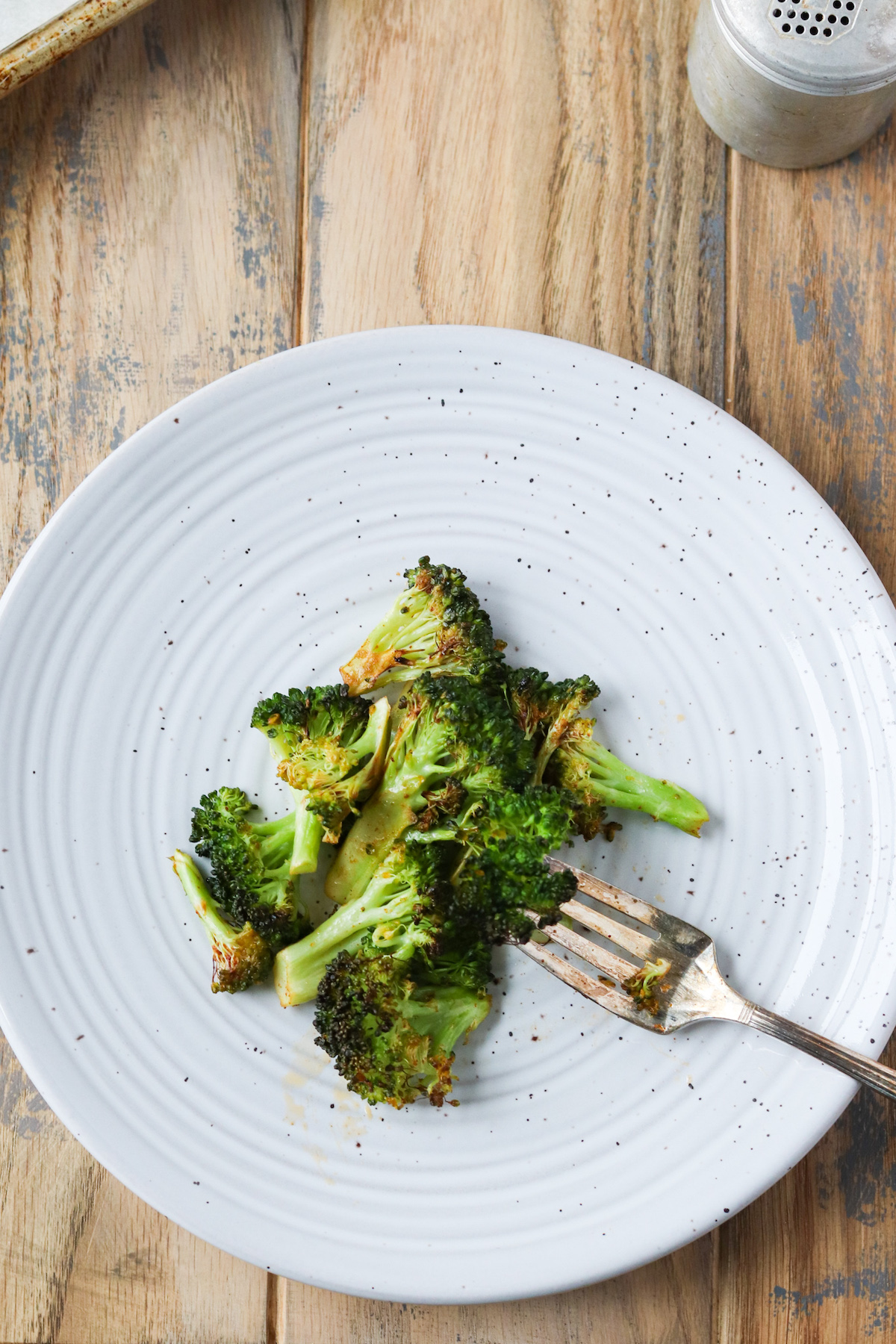 plate with cooked chipotle butter roasted broccoli