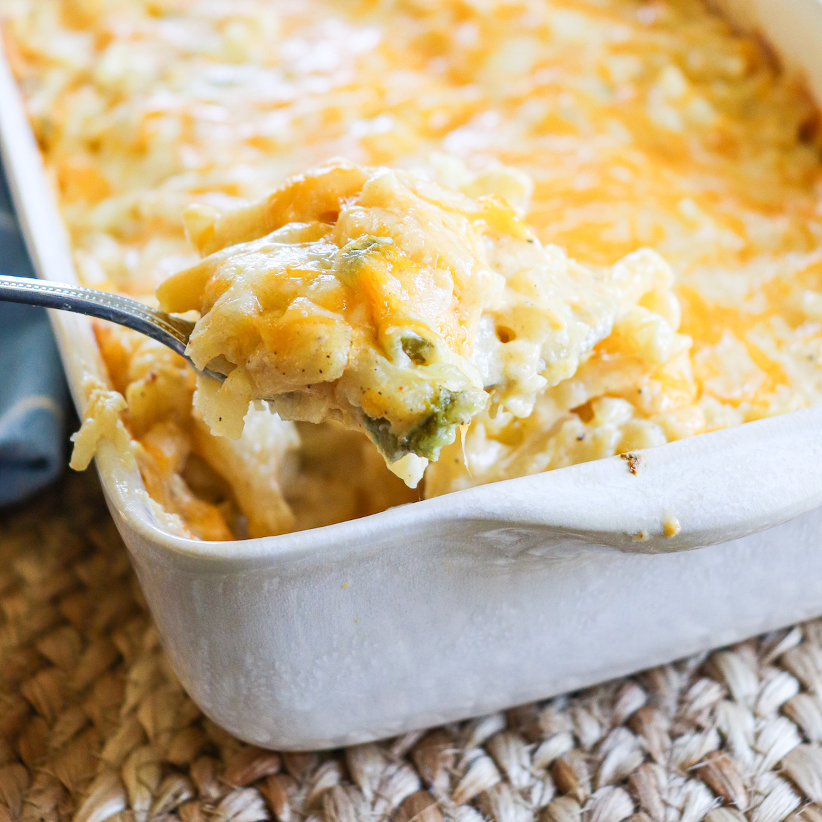 closeup of cheesy jalapeno hash brown casserole on a spoon