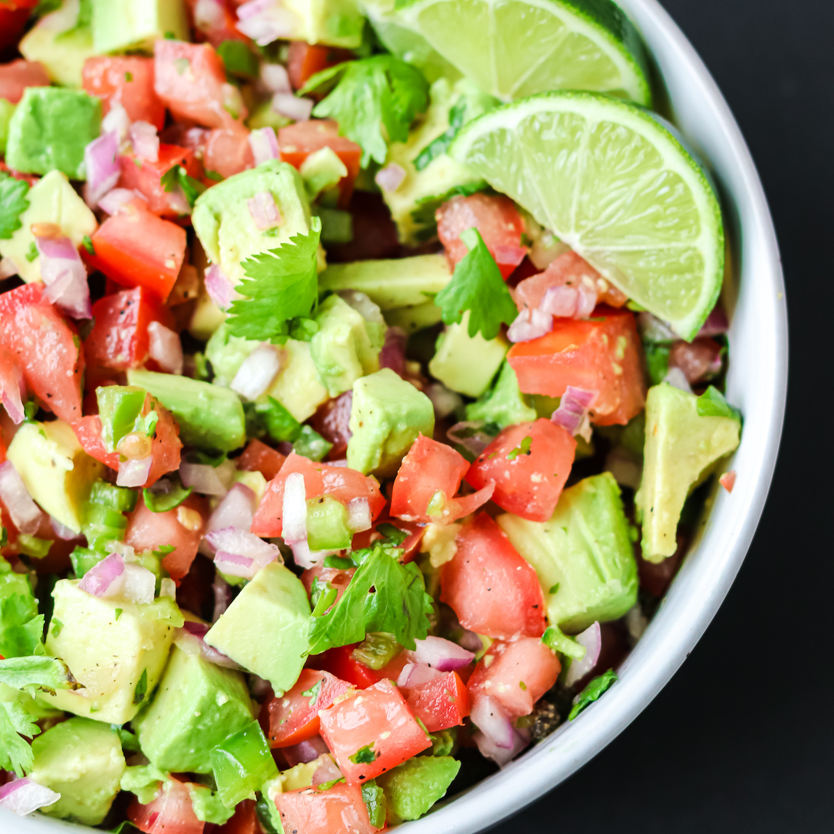 Prepared pico de gallo with avocado in a bowl