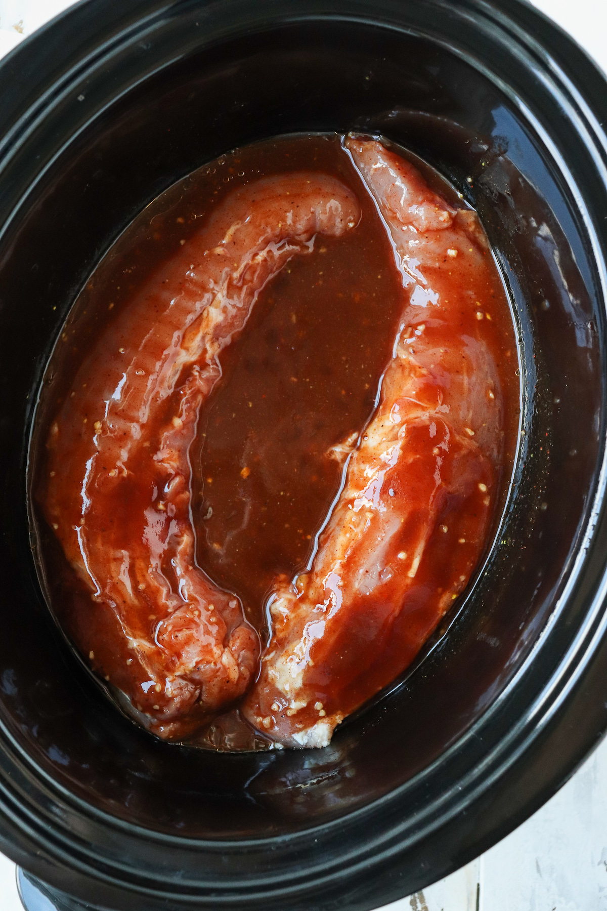 pork tenderloin in bbq sauce in a crockpot