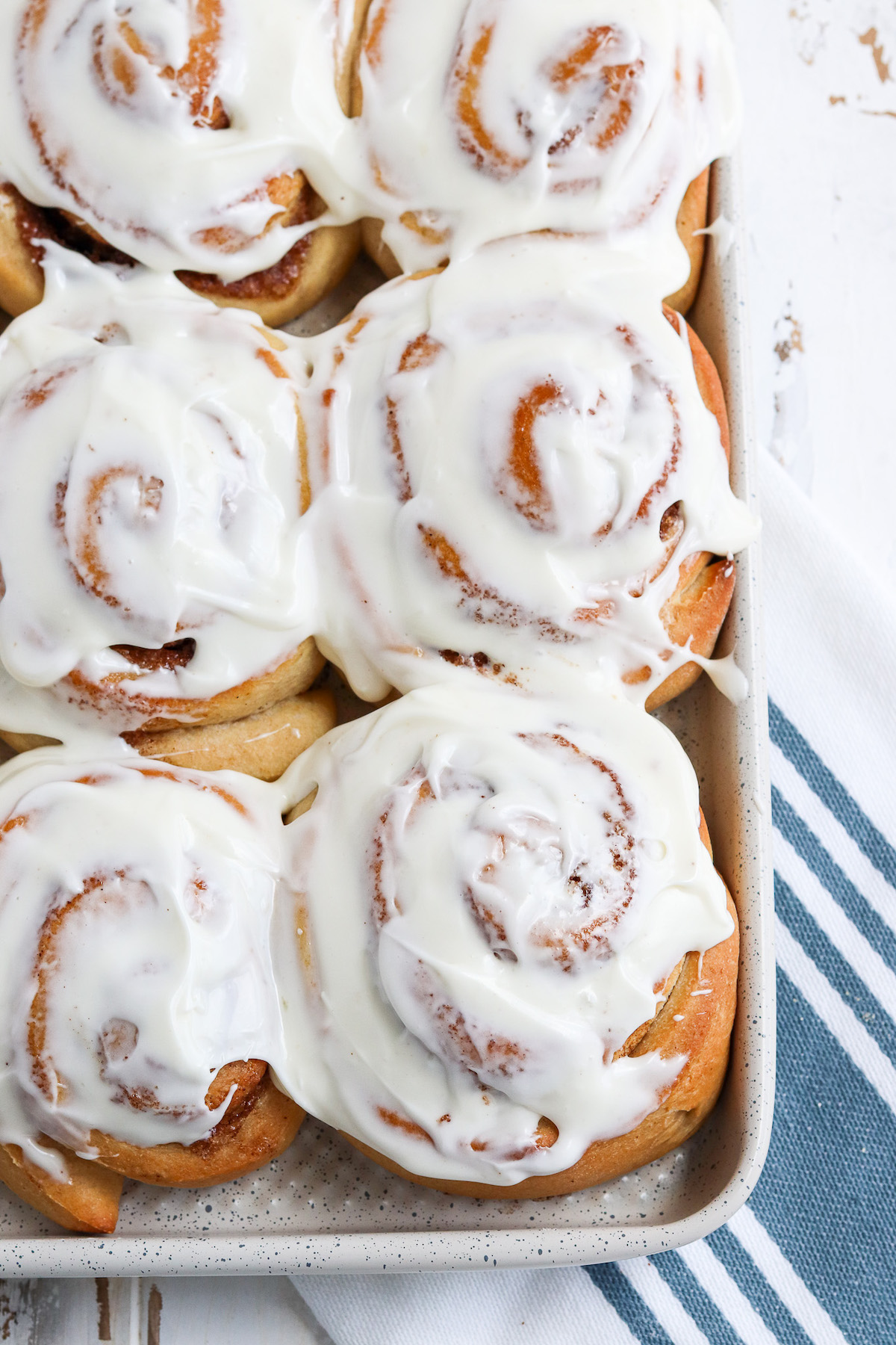 up close of cinnamon roll with cream cheese frosting