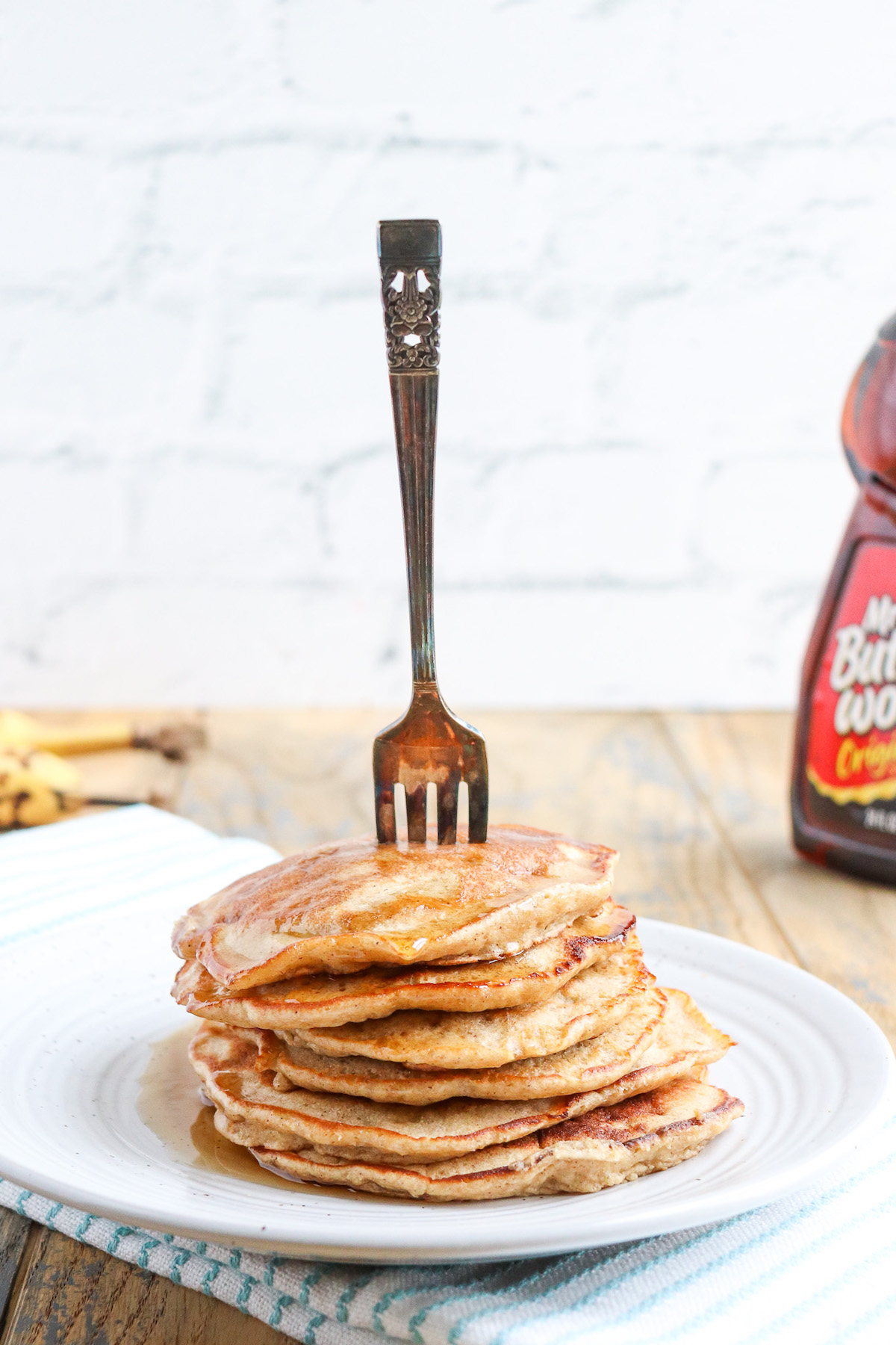 a stack of 6 pancakes with a fork in them