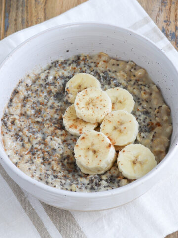 close up of prepared oatmeal with banana and lots of chia seeds