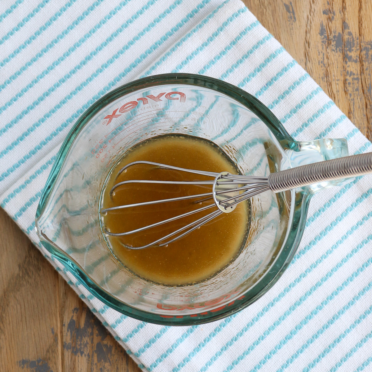 small bowl with whisk and marinade ingredients