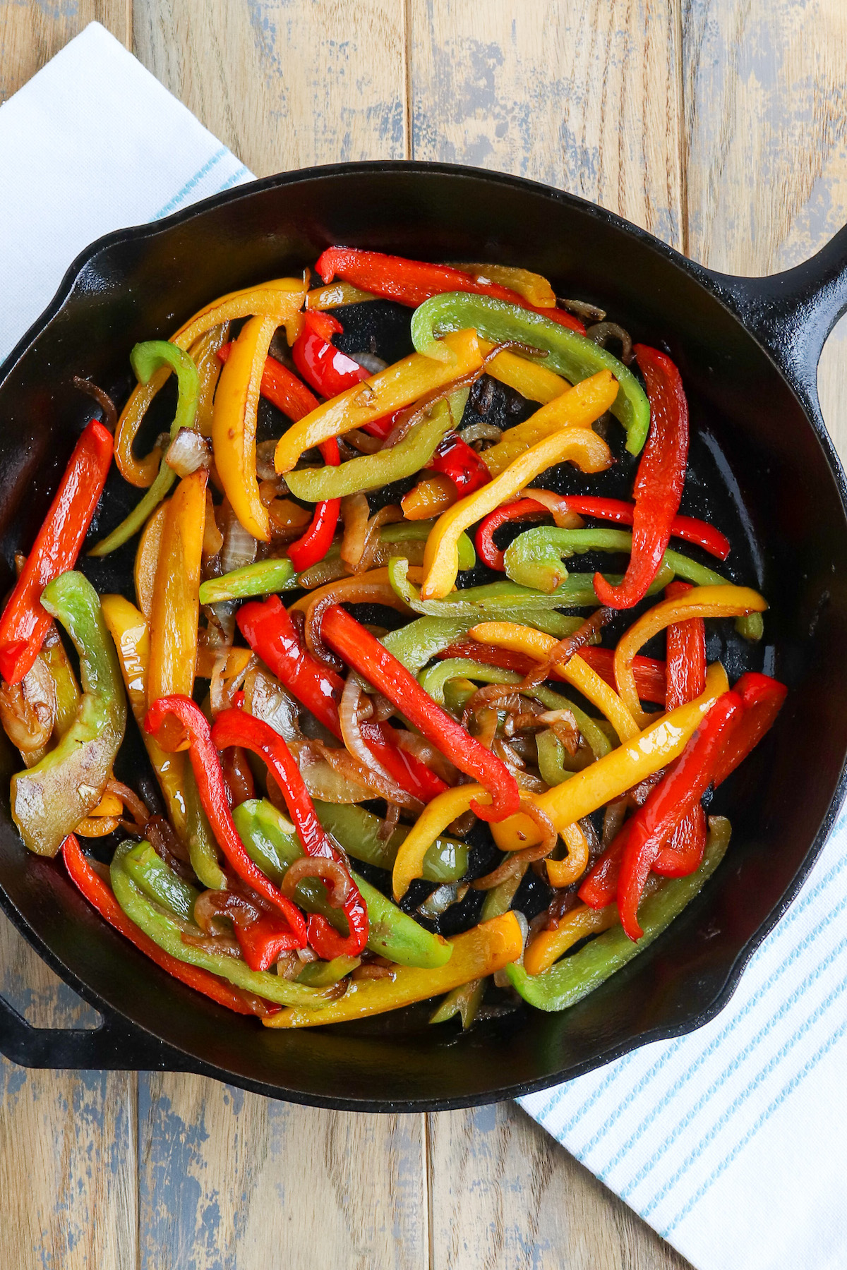 skillet of prepared cooked bell peppers and onions