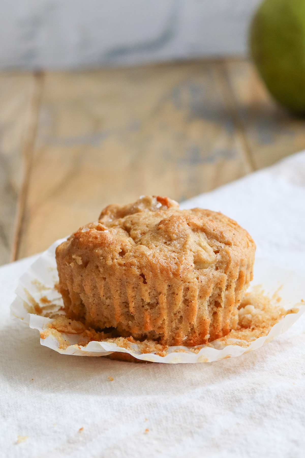 closeup of an unwrapped muffin with pears