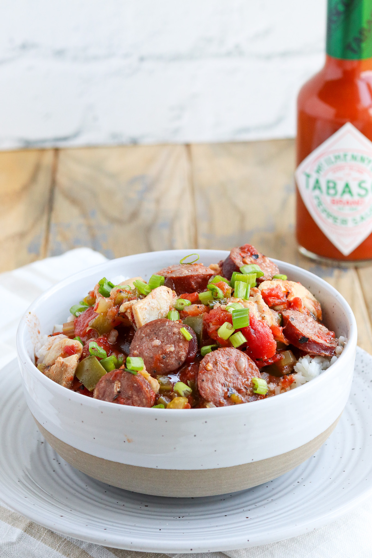 bowl of rice, jambalaya served with tabasco sauce