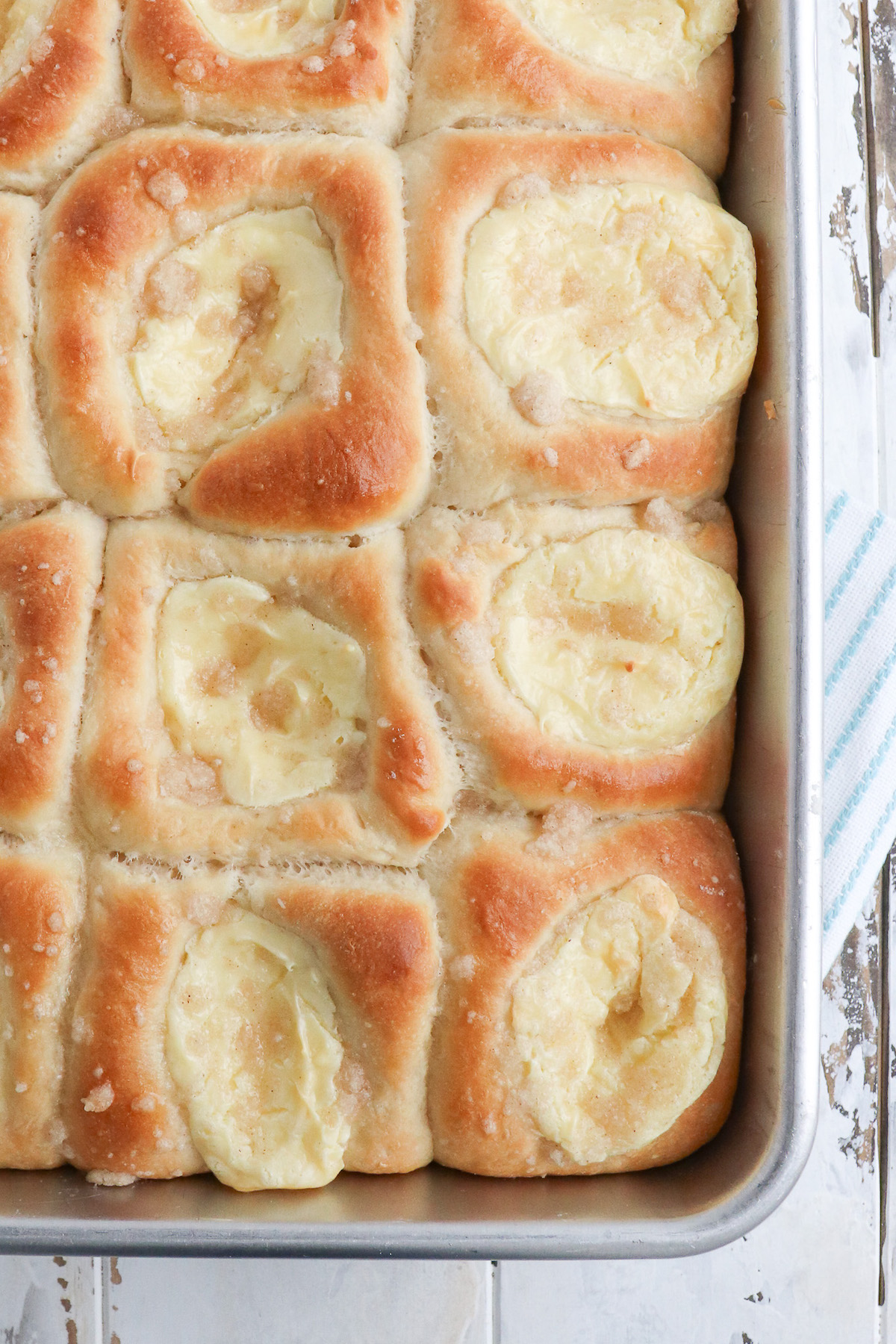 a baking sheet of golden brown baked kolaches