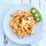 plate of migas with melted cheese and visible tortilla chips