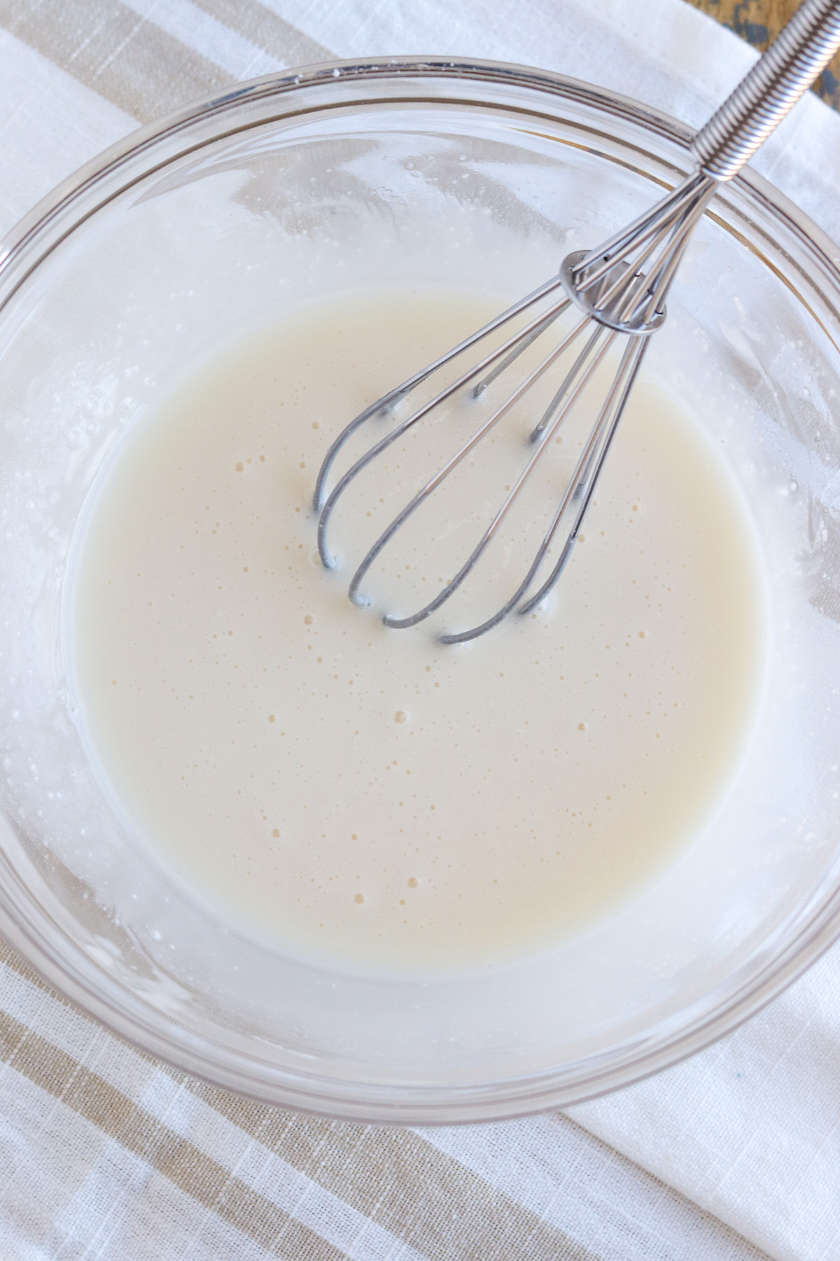 bowl of icing with whisk