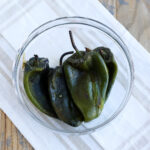 bowl of peeled poblano peppers