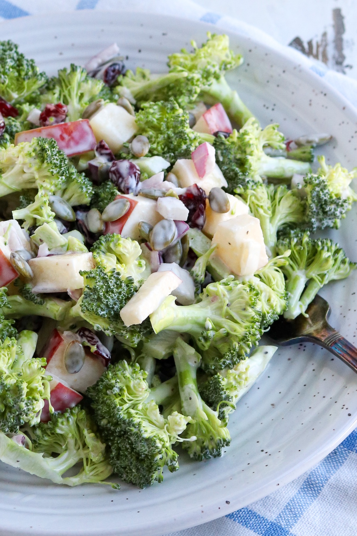 plate of crisp broccoli salad lightly dressed