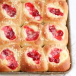 baked kolaches filled with cream cheese and fruit filling and streusel topping
