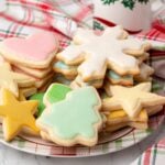 plate of assorted cut out and frosted Christmas sugar cookies