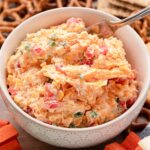 bowl of jalapeno pimento cheese with creamy texture and visible pimento and jalapeno