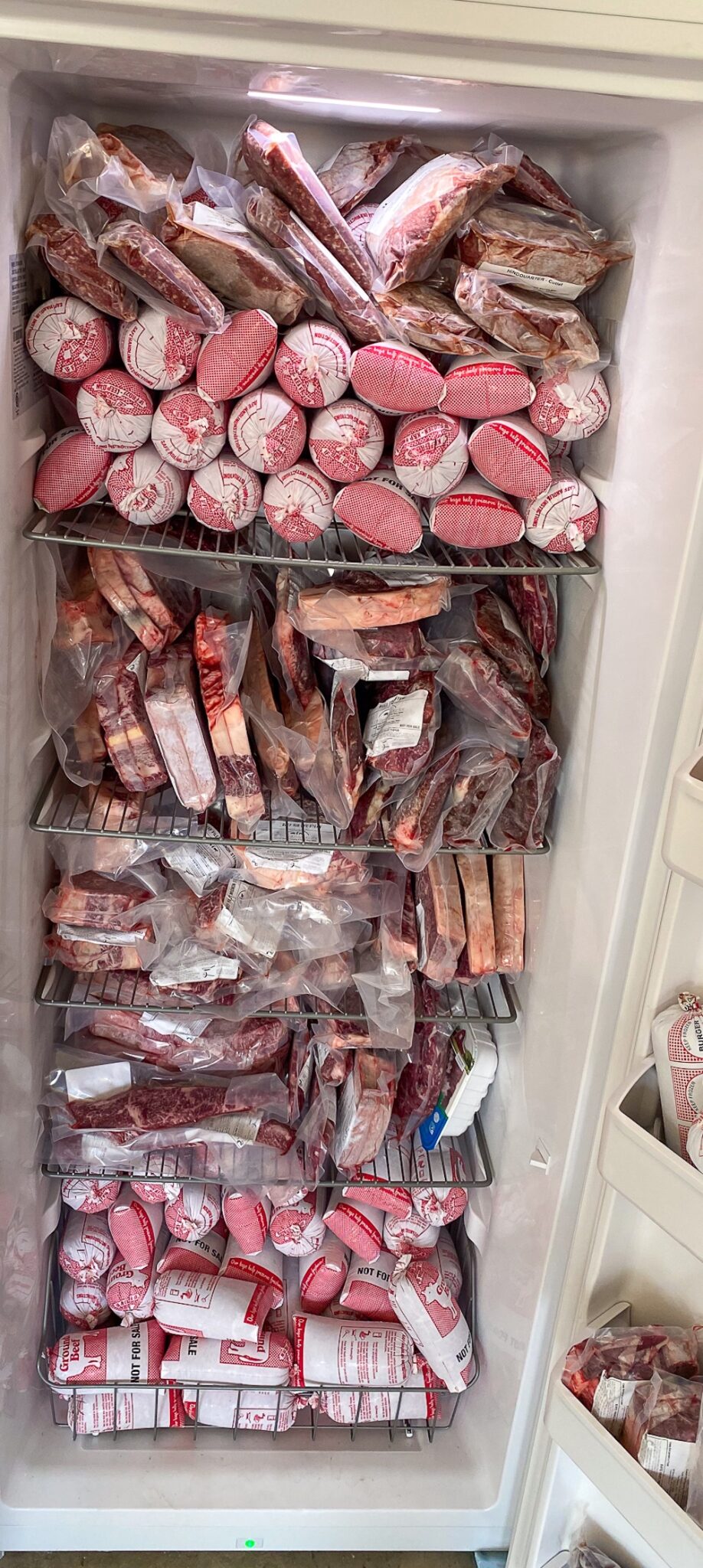 a freezer filled with a side of beef