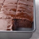 9 x 13 chocolate buttermilk cake with fudge chocolate glaze cut into squares