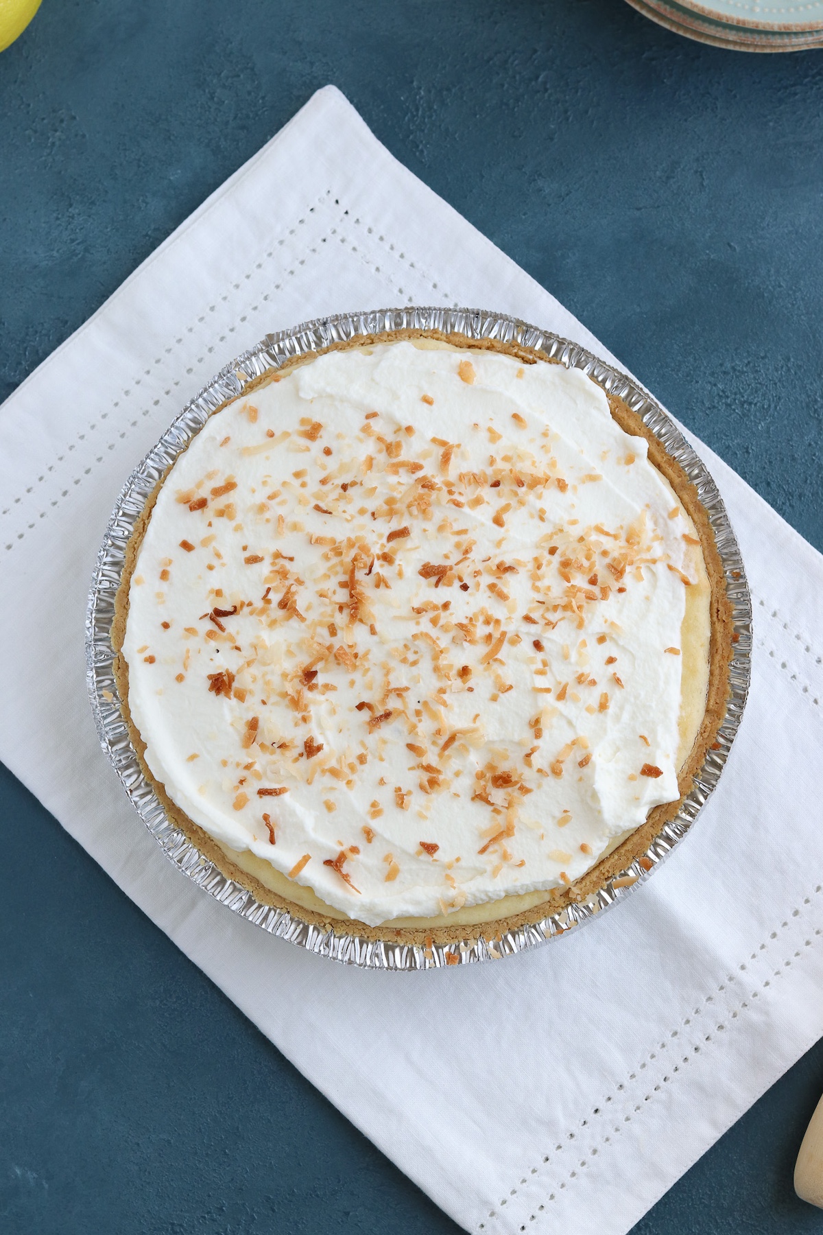 prepared pie with whipped topping and toasted coconut