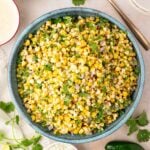 turquoise bowl filled with grilled corn salad
