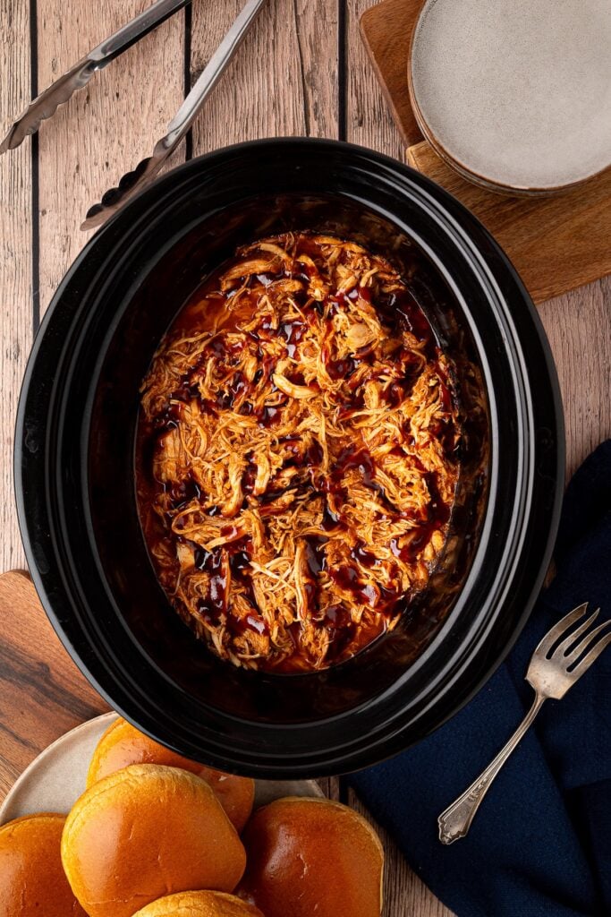 cooked chicken breast shredded in crock pot with extra bbq sauce