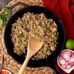 skillet of cooked turkey taco meat with cilantro garnish