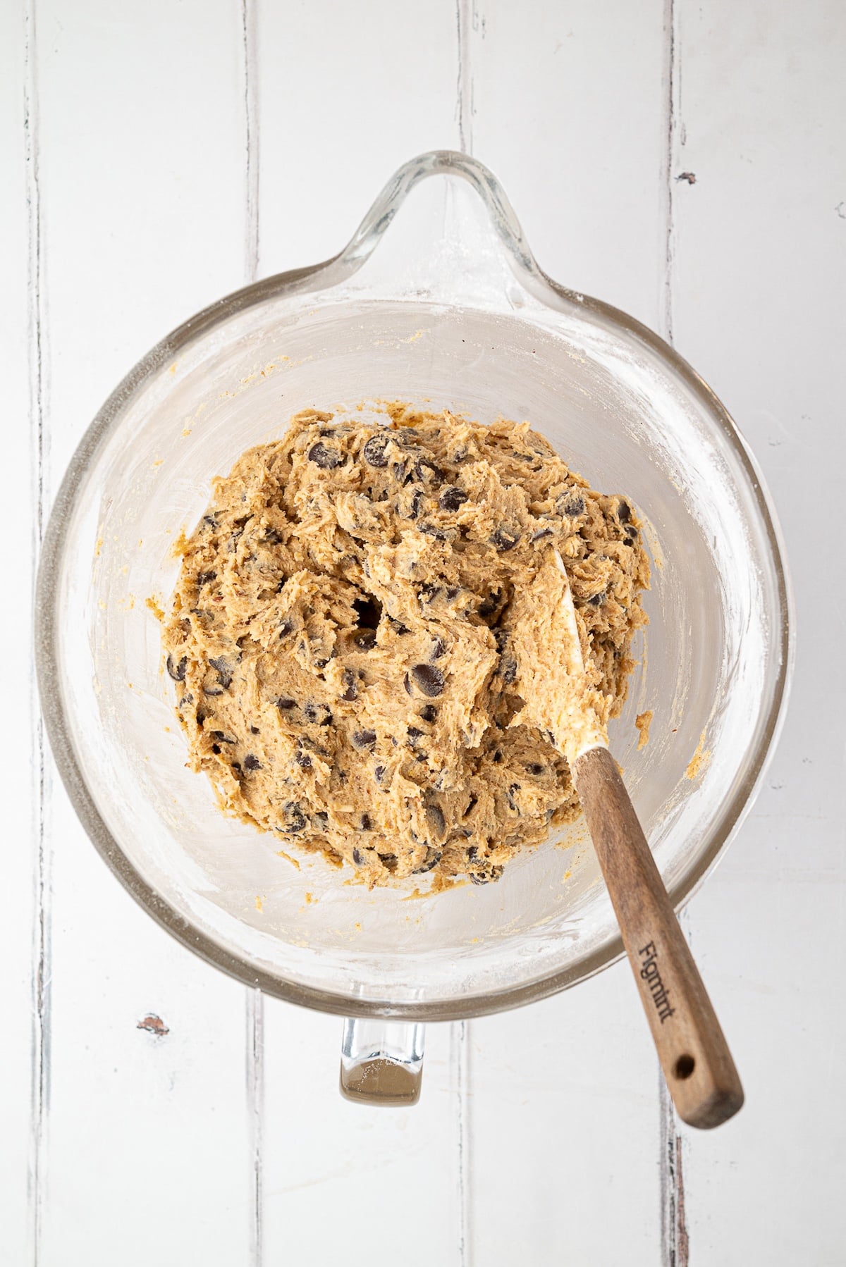 healthy chocolate chip cookie dough with chocolate chips in a stand mixer bowl
