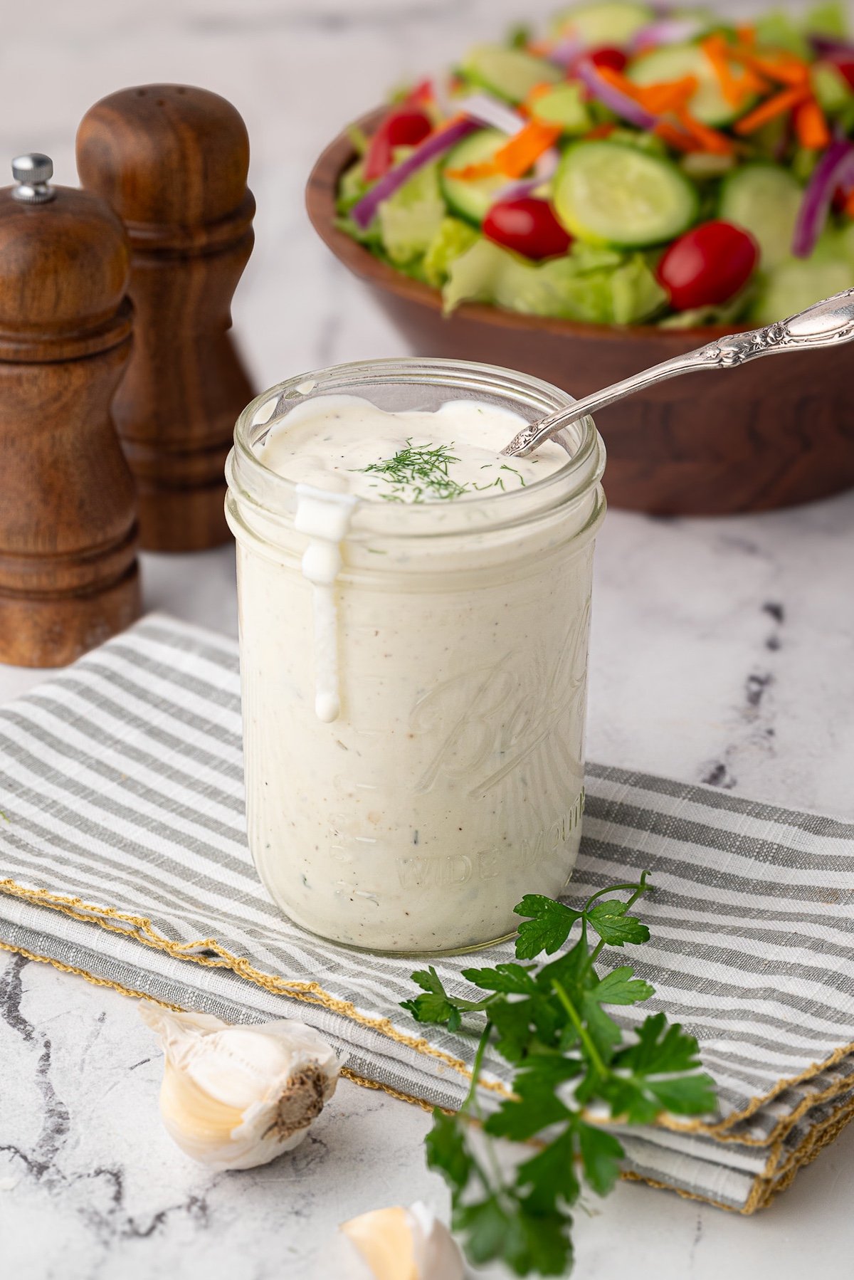 mayonnaise buttermilk ranch in jar with salad