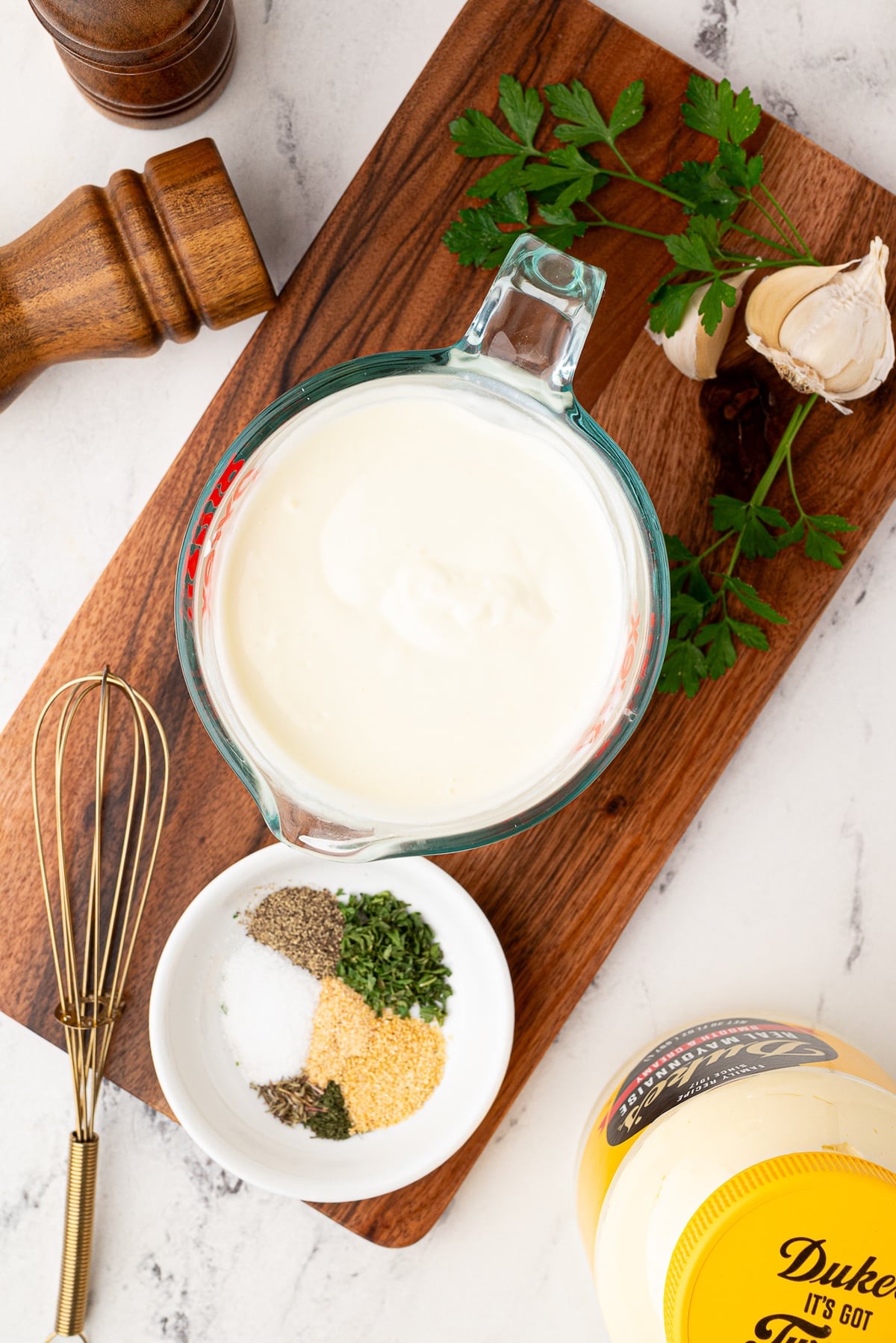 whisking together spices, buttermilk and mayonnaise