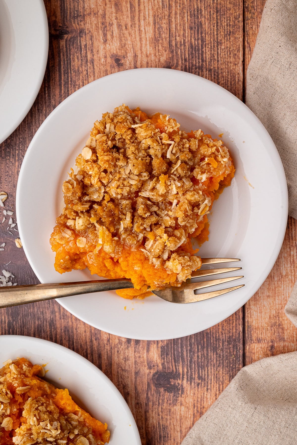 a holiday plate with a generous portion of sweet potato casserole
