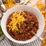 thick Texas style chili with no beans to be served with Fritos and cheese