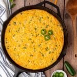 classic Jalapeno Corn Casserole with a creamy consistency and jalapenos for a bit of spice in a cast iron skillet