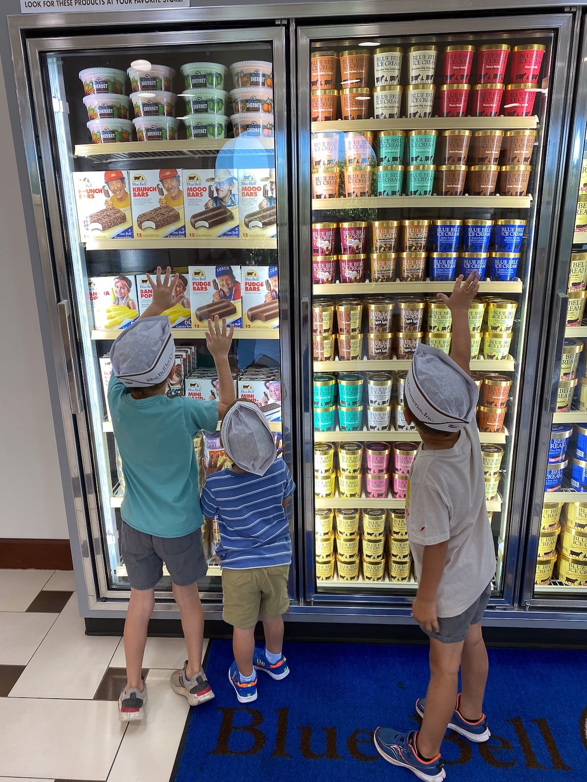 Alaine's three sons touring the Blue Bell Creameries in Brenham, Texas, during a family outing.