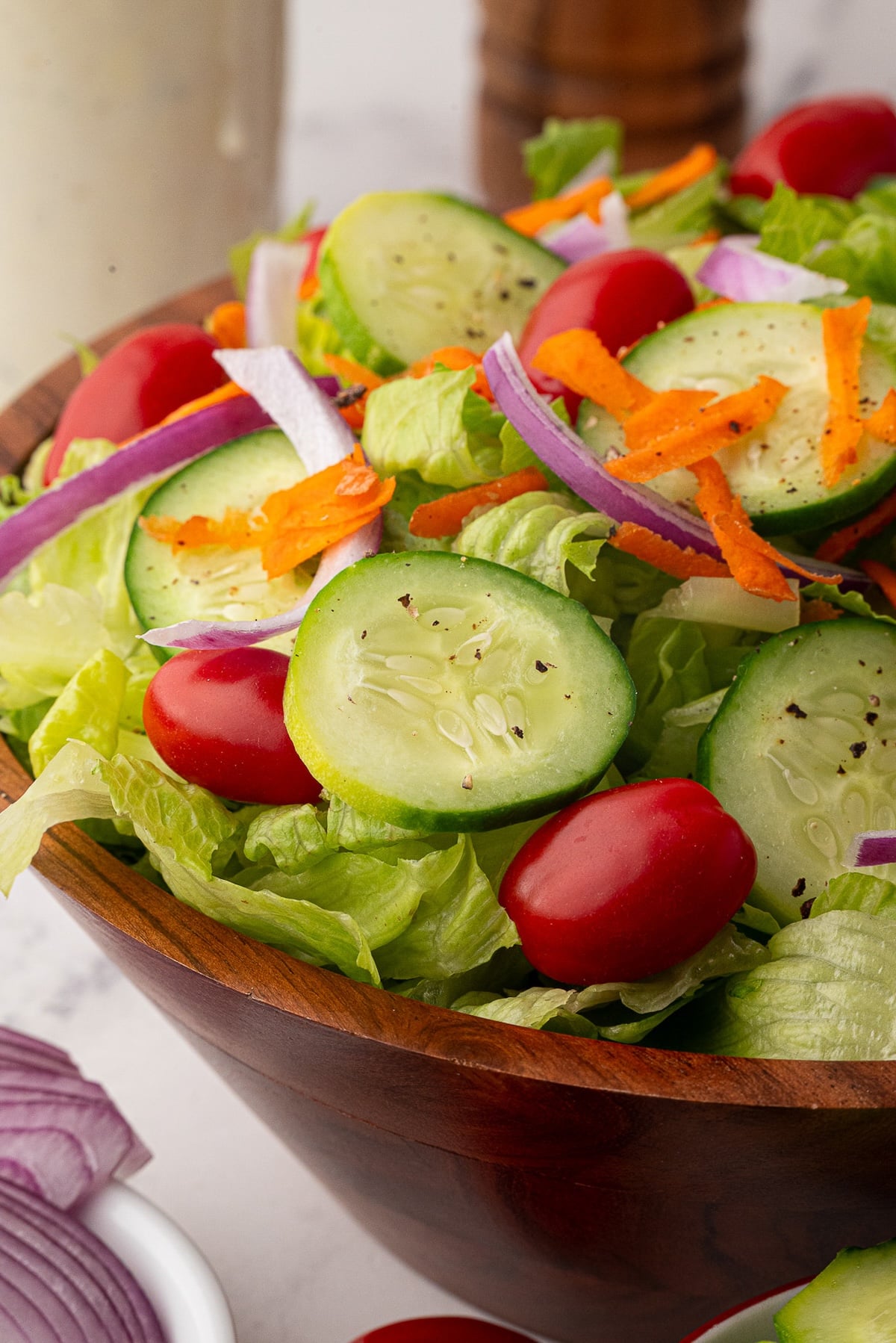 Thinly sliced cucumbers top the restaurant style salad.
