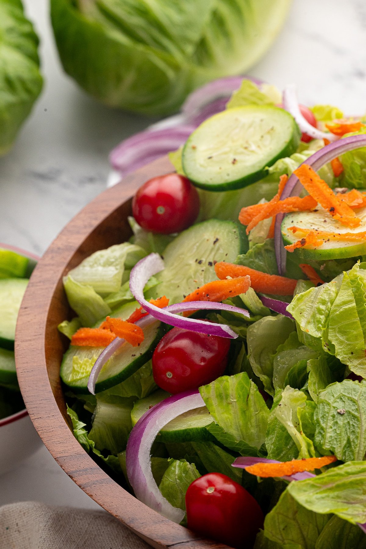 A large salad bowl of prepared garden salad.