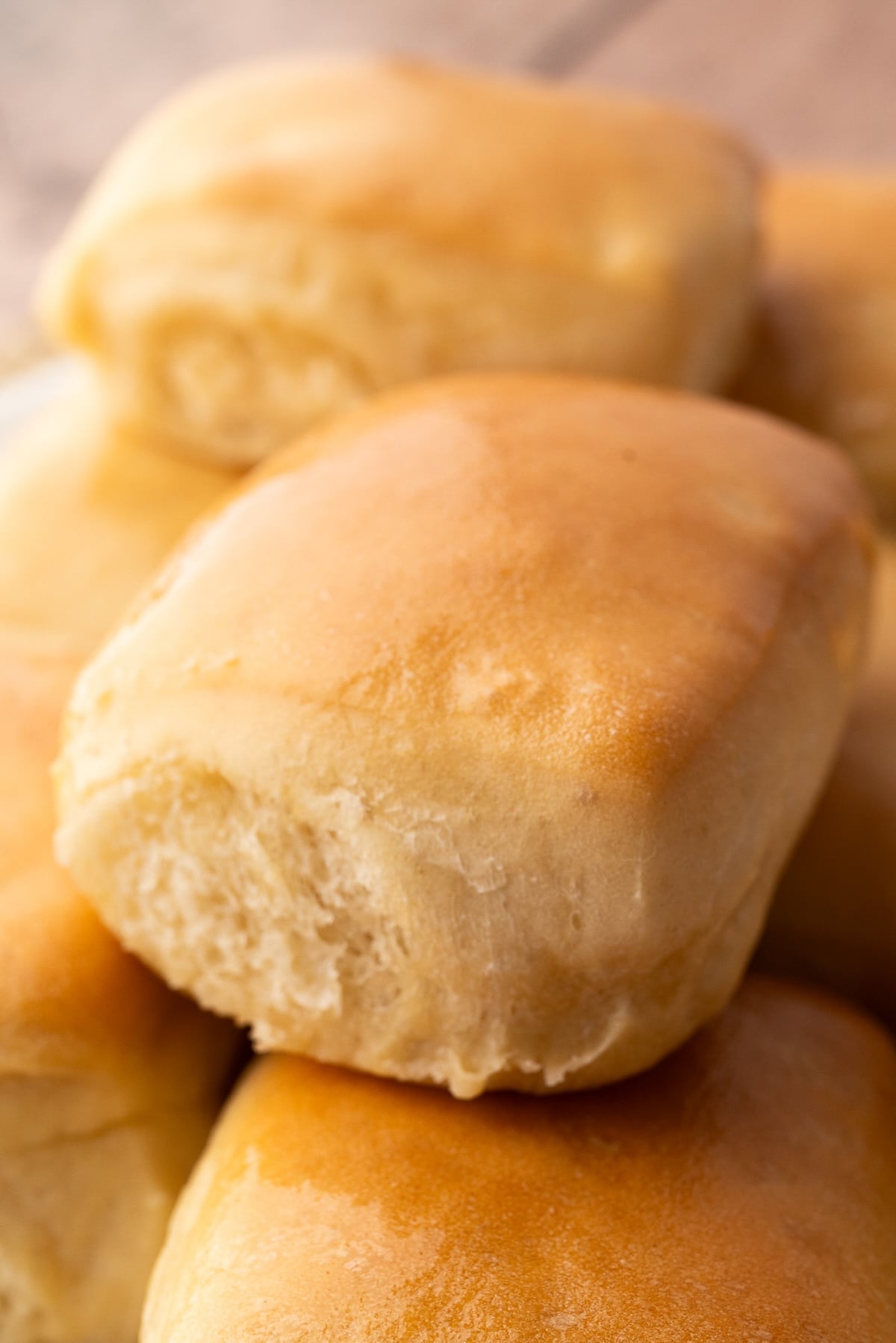 Closeup of a fluffy, baked dinner roll.