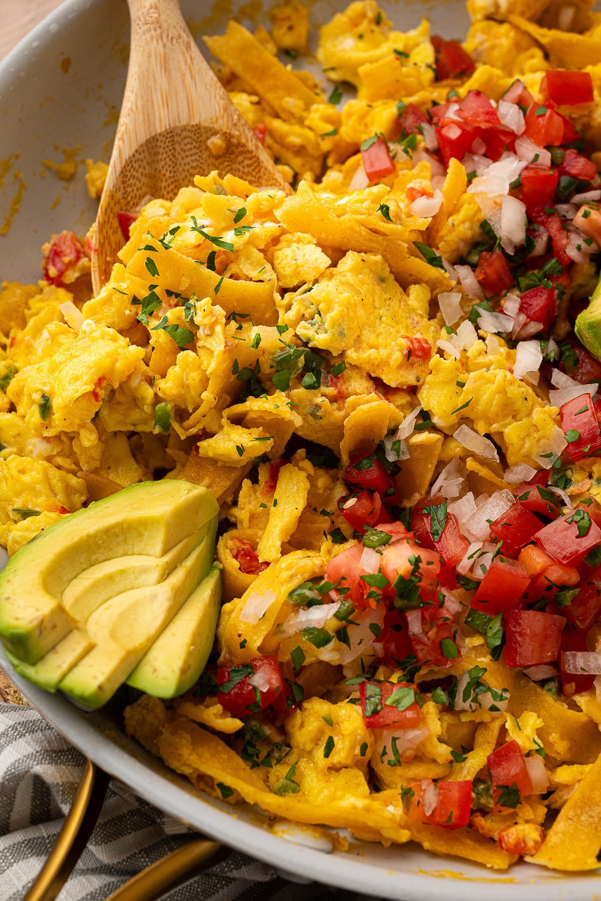 Closeup of the corn tortilla strips in the cooked egg mixture.
