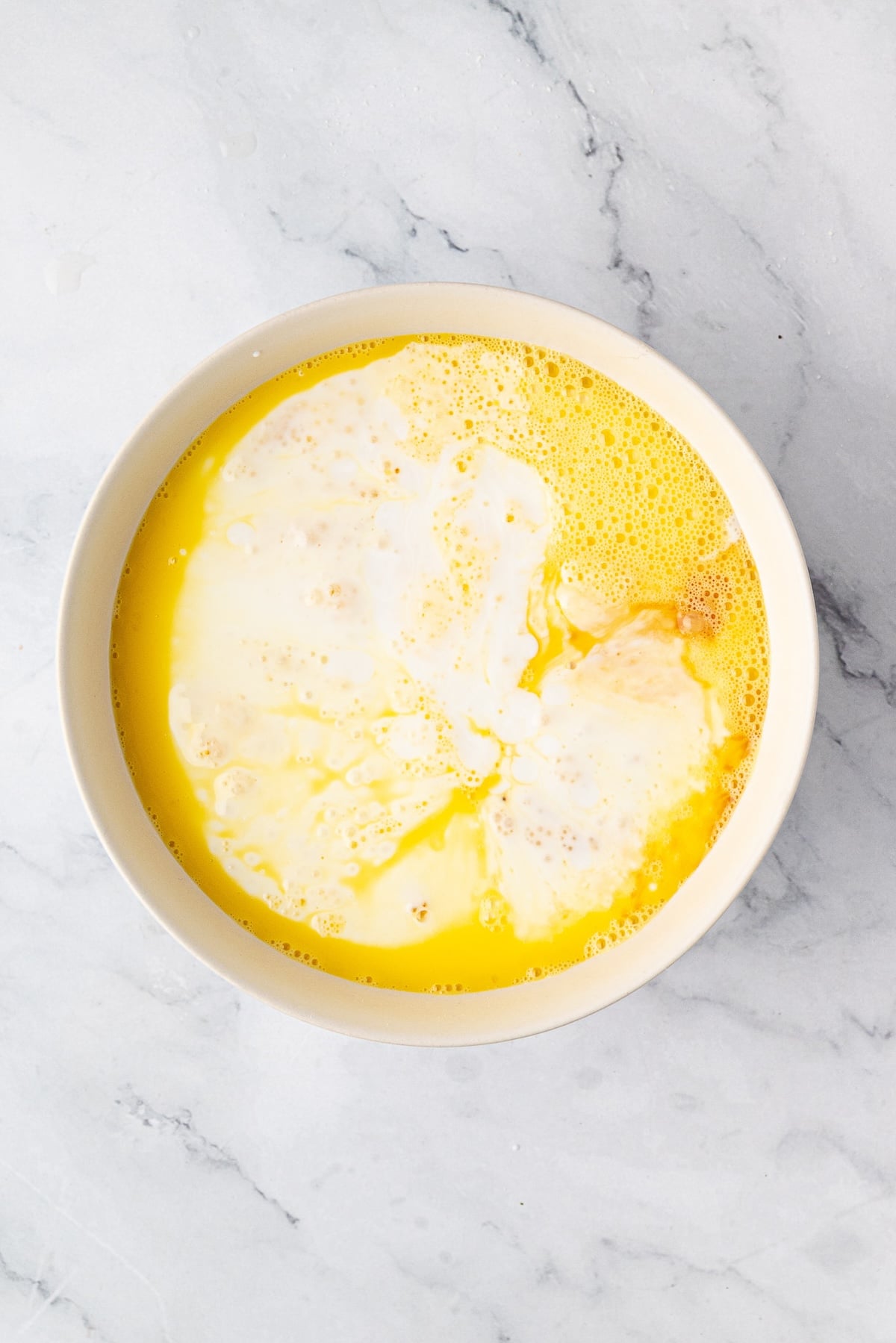 Whisked eggs, buttermilk and vanilla in a large mixing bowl.