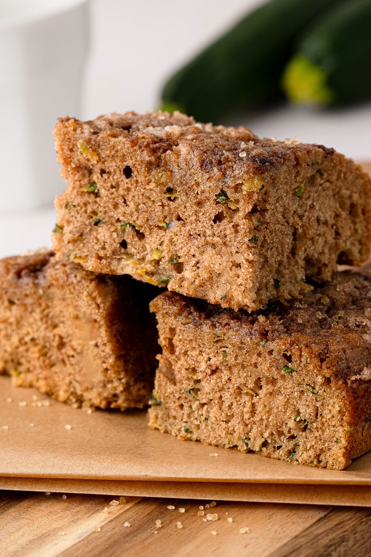 Several square slices of homemade cinnamon zucchini coffee cake arranged for serving.