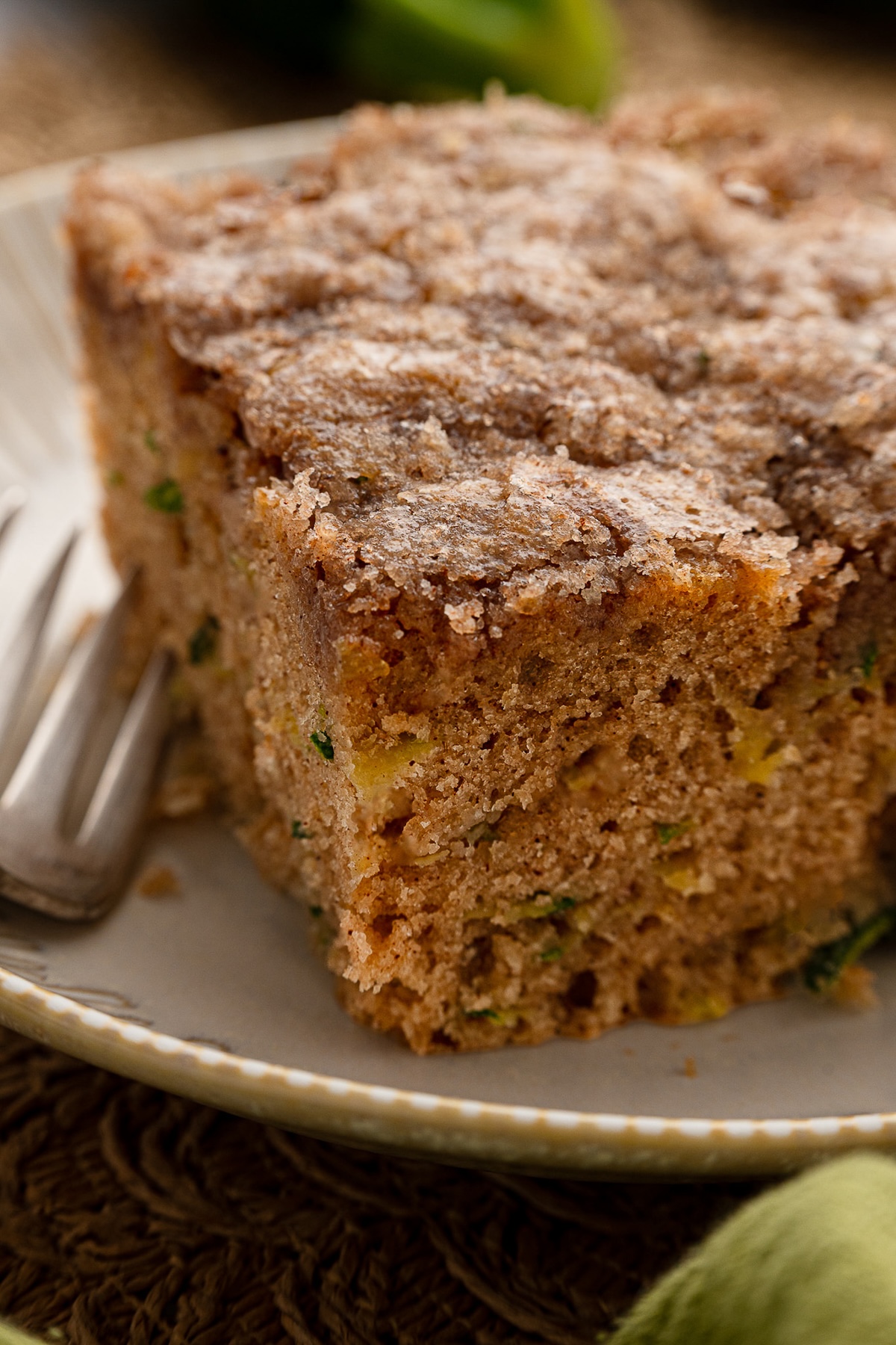 Closeup showing the crackly top and moist texture of the zucchini cake.