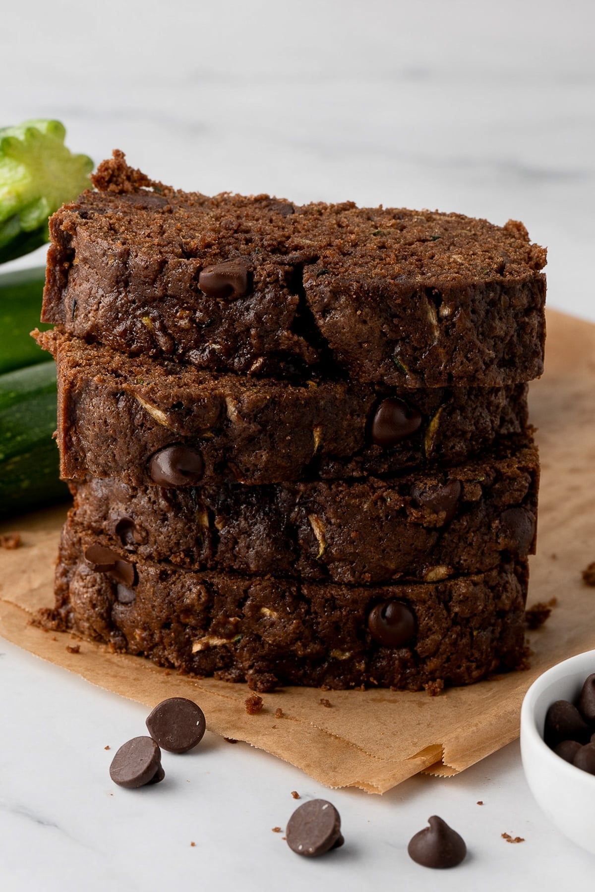 Homemade chocolate zucchini bread with chocolate chips, sliced and ready to serve.