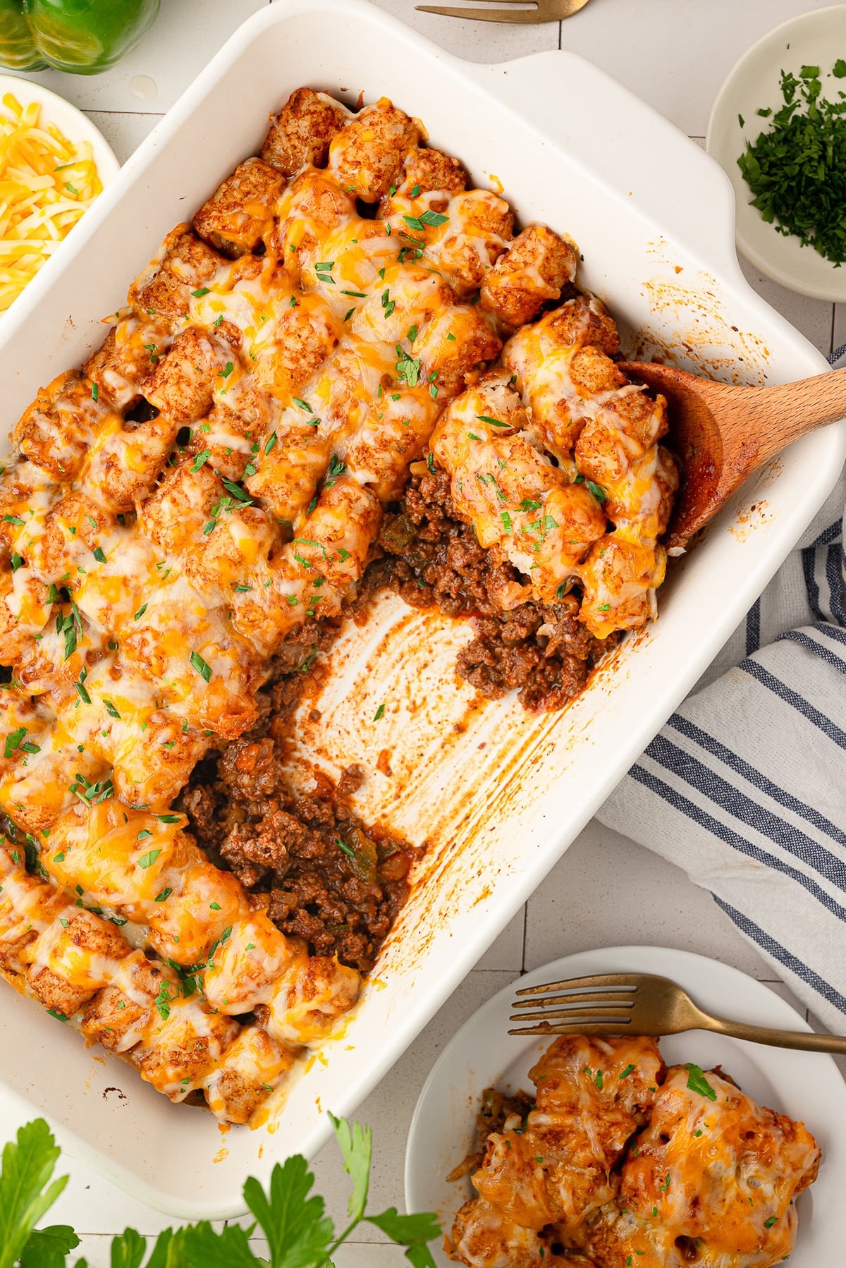 Showing the sloppy Joe base and crisp tater tots on the nostalgic weeknight dinner.